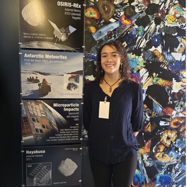 Jae Dancer poses with meteorite research