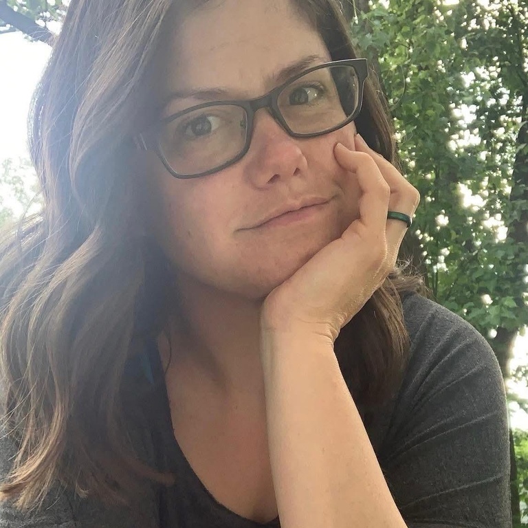 A woman wearing glasses with long brown hair, Mandy Duffey, Instructional Services Specialist SEES