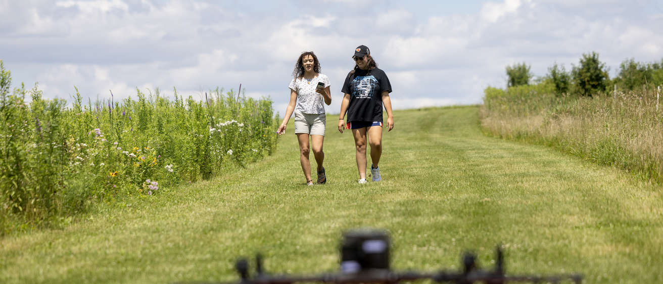 Students walking the prairie at Ashton Praiire