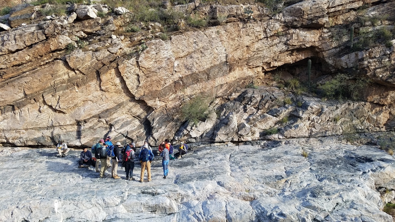 Students on a field trip in front of rock formations